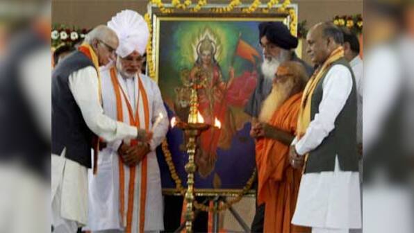 Gujarat committed to Aadhar: Modi tells Nilekani