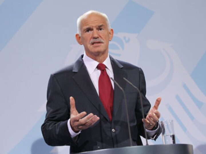 Greek PM wins confidence vote, pledges transition