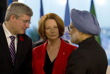 Singh, Gillard meet in Bali; discuss uranium sale issue Singh, Gillard meet in Bali; discuss uranium sale issue