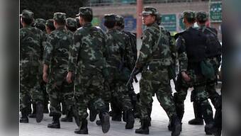 China rushes thousands of police to restive Xinjiang
