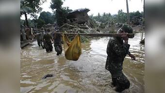 Philippines storm toll exceeds 1,000 as cities prepare burials