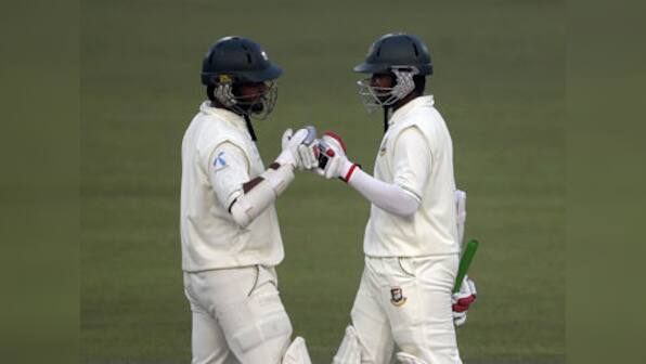 Shakib, Nafees defy Pakistan with record stand