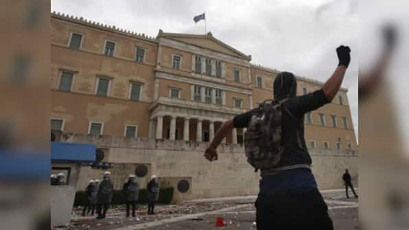 Greece passes austerity budget after street clashes