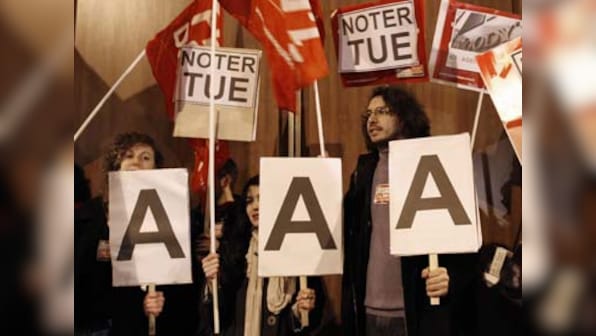 Euro empire totters on rating shock; France loses AAA status