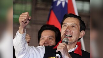 Taiwan's president wins close re-election fight
