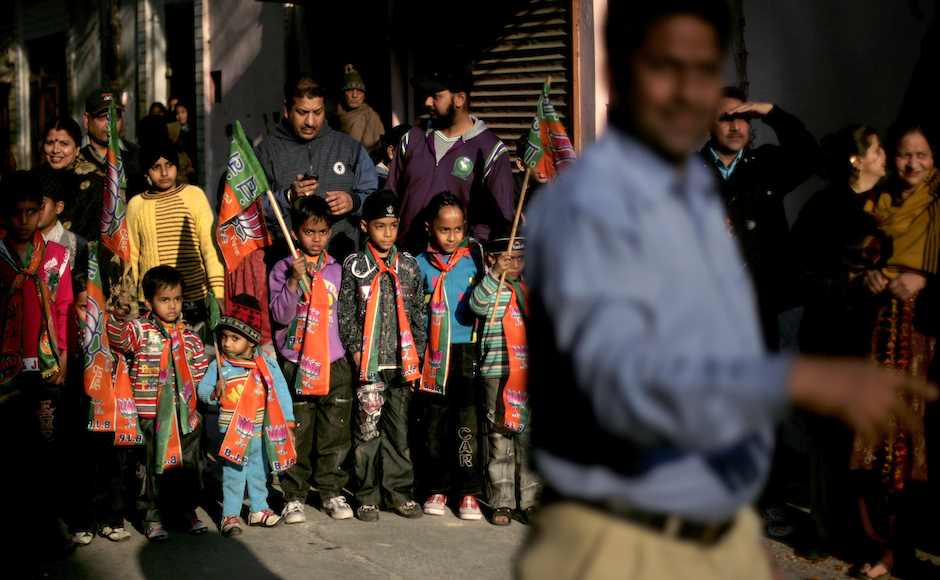Young Indian boys and other supporters wait for India's main opposition Bharatiya Janata Party (BJP) leader and former Indian cricketer Navjot Singh Sidhu, unseen, during his roadshow on the last day of campaigning for upcoming Assembly elections in Amritsar, India, Saturday, Jan. 28, 2012. (AP Photo/Altaf Qadri) Young Indian boys and other supporters wait for India's main opposition Bharatiya Janata Party (BJP) leader and former Indian cricketer Navjot Singh Sidhu, unseen, during his roadshow on the last day of campaigning for upcoming Assembly elections in Amritsar, India, Saturday, Jan. 28, 2012. (AP Photo/Altaf Qadri)