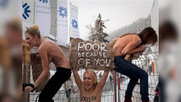 Topless Ukrainian protesters disrupt Davos event
