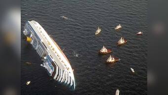 Cruise liner aground off Italy; 3 dead, 70 missing, search on