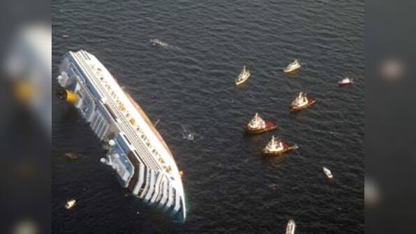 Cruise liner aground off Italy; 3 dead, 70 missing, search on