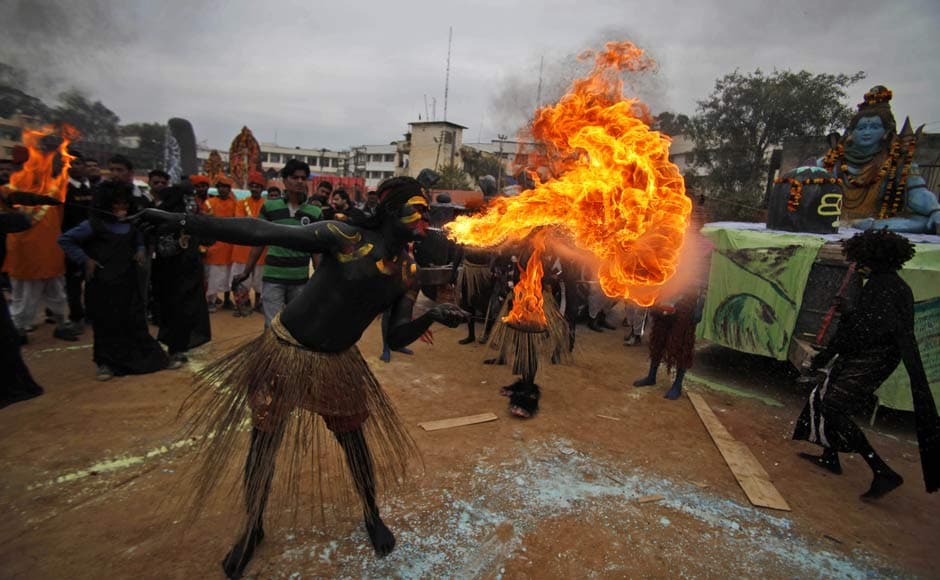 A fire eater entertains the crowd during a procession ahead of Shivratri festival, in Jammu. AP A fire eater entertains the crowd during a procession ahead of Shivratri festival, in Jammu. AP