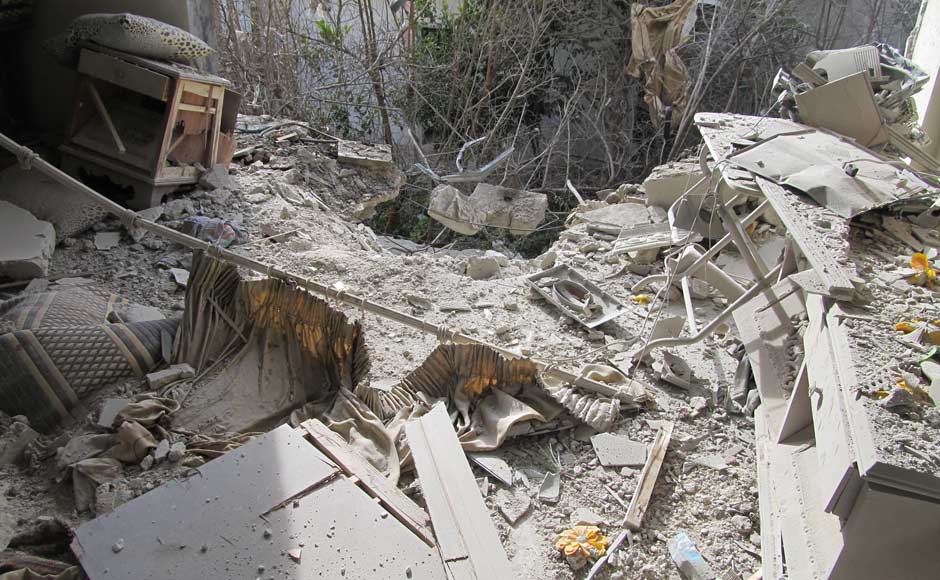 Rubble is seen in a damaged house in the Sunni Muslim district of Bab Amro in Homs in this handout picture. Reuters Rubble is seen in a damaged house in the Sunni Muslim district of Bab Amro in Homs in this handout picture. Reuters