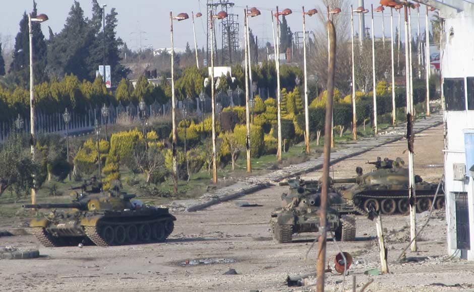Syrian tanks are seen in Bab Amro near the city of Homs. Reuters Syrian tanks are seen in Bab Amro near the city of Homs. Reuters
