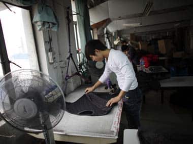 An employee works at a textile factory in Yiwu, Zhejiang province