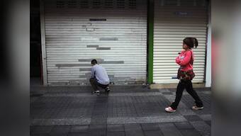 China's unofficial lending falters, savers protest 
