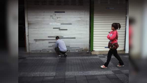 China's unofficial lending falters, savers protest 
