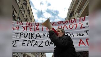 Greece to vote on tough salary, pension cuts 