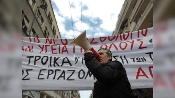 Greece to vote on tough salary, pension cuts 