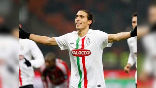 Unbeaten Juventus edge past Milan in Italian Cup semis