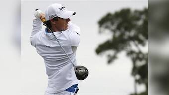 McIlroy holds off Tiger threat to take top golf spot
