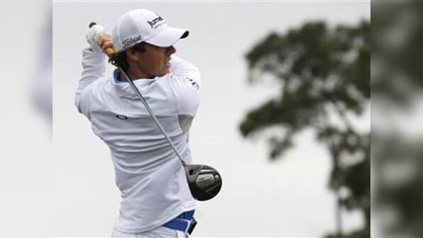 McIlroy holds off Tiger threat to take top golf spot