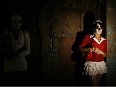 Sex workers wear skeleton masks, a traditional Mexican symbol representing the Day of the Dead, after a procession in Mexico city October 29, 2011. More than 100 sex workers gathered for a procession to remember their deceased colleagues, especially those who were violently murdered in the last few years, two days before the Day of the Dead. Reuters