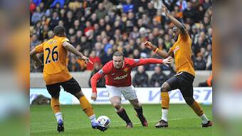 Rooney apologises for breaking young fan's wrist