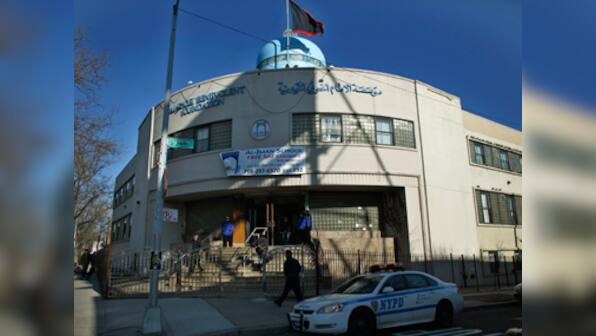 American charged with hate crime for attacks on temple, mosque