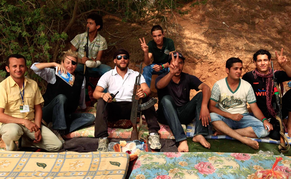 Journalist Marie Colvin (2nd Left) poses for a photograph with Libyan rebels in Misrata in this 4 June, 2011 file photograph. Two Western journalists, Marie including were killed in the besieged Syrian city of Homs on February 22, 2012 when shells hit the house they were staying in, opposition activists and witnesses said. Reuters Journalist Marie Colvin (2nd Left) poses for a photograph with Libyan rebels in Misrata in this 4 June, 2011 file photograph. Two Western journalists, Marie including were killed in the besieged Syrian city of Homs on February 22, 2012 when shells hit the house they were staying in, opposition activists and witnesses said. Reuters