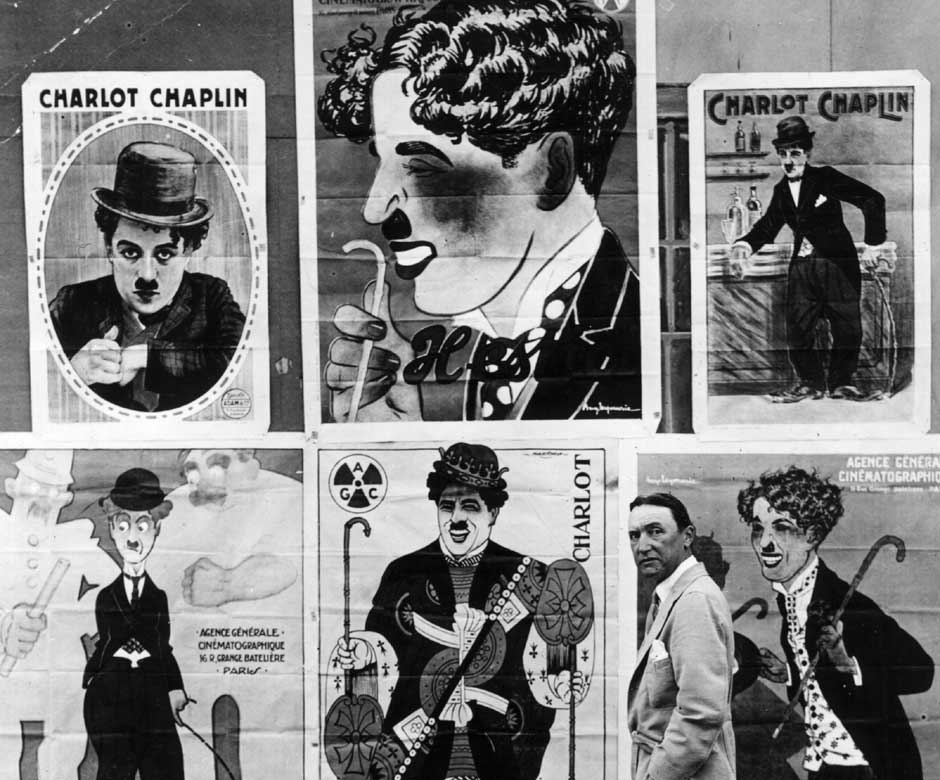 Alfred Reeves with a selection of French posters advertising Charlie Chaplin films. Getty Images Alfred Reeves with a selection of French posters advertising Charlie Chaplin films. Getty Images