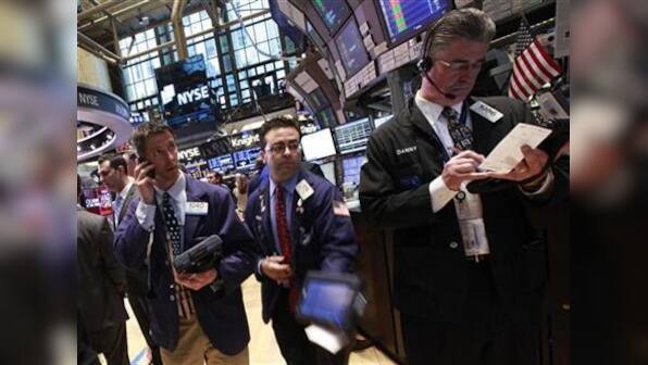 Wall St up on earnings but tech, banks weigh