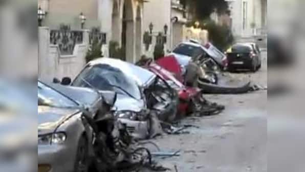 Syria forces shell Homs as UN votes on observers