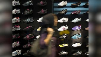 Adidas raises outlook, announces India probe 
