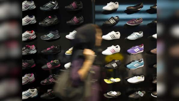 Adidas raises outlook, announces India probe 