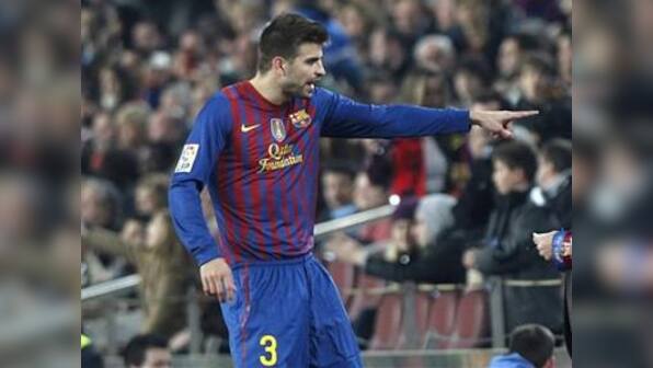 Barcelona's Guardiola, Pique play down rift reports