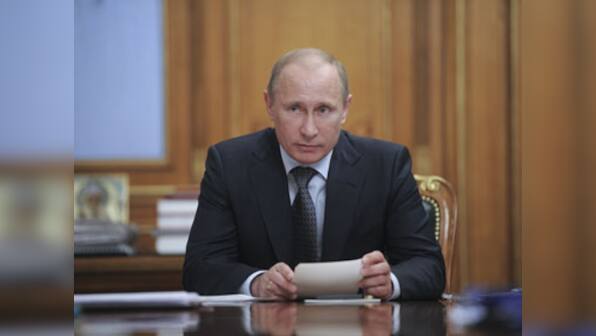 Putin steps down as ruling party chief