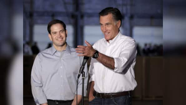 Romney shifting toward centre on big primary day 