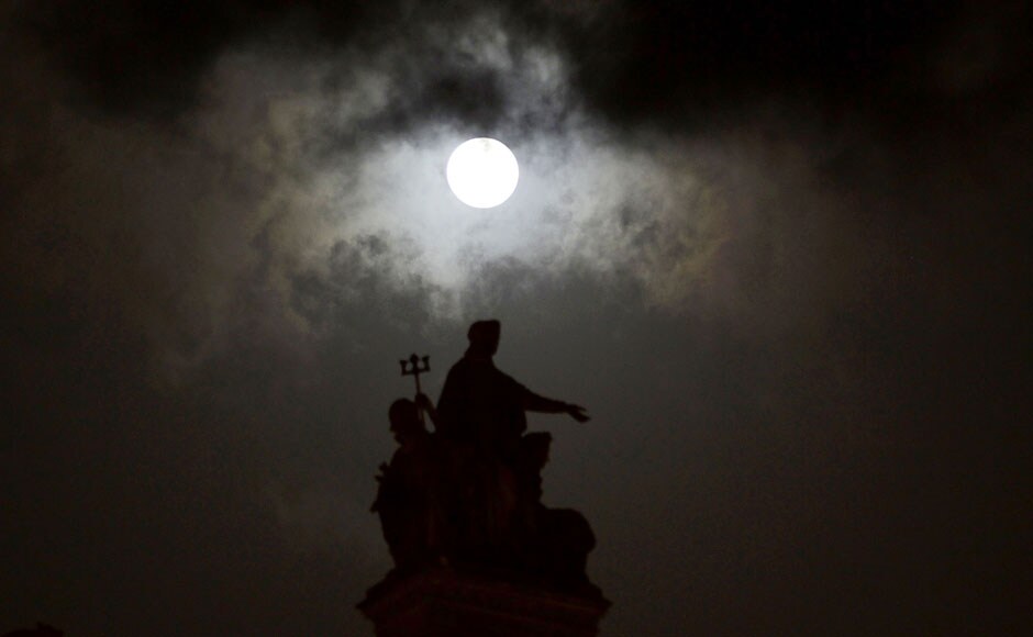 The supermoon is seen over the landmark Chhatrapati Shivaji Terminus in Mumbai. AP The supermoon is seen over the landmark Chhatrapati Shivaji Terminus in Mumbai. AP