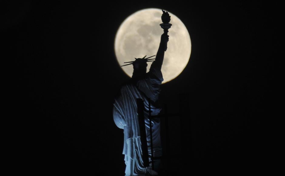 The full moon rises behind Statue of Liberty replica atop of a hotel in Kosovo's capital Pristina. AP The full moon rises behind Statue of Liberty replica atop of a hotel in Kosovo's capital Pristina. AP