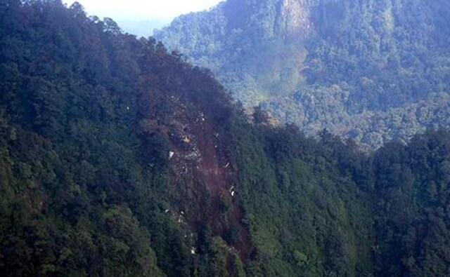 The wreckage of a missing Sukhoi Superjet-100 are scattered on the mountainside in Bogor, West Java, Indonesia. AP