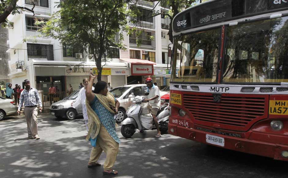 I'm angry and I will destroy this bus, never mind that it doesn't run on petrol: A woman throws a stone at a local transport bus during a nationwide strike to protest a steep hike in gas prices in Mumbai. Rajanish Kakade/AP I'm angry and I will destroy this bus, never mind that it doesn't run on petrol: A woman throws a stone at a local transport bus during a nationwide strike to protest a steep hike in gas prices in Mumbai. Rajanish Kakade/AP