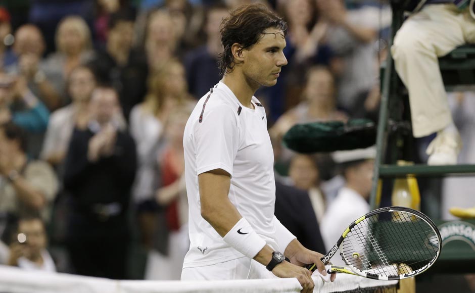 Nadal waits at the net after being defeated by Rosol. AP Nadal waits at the net after being defeated by Rosol. AP