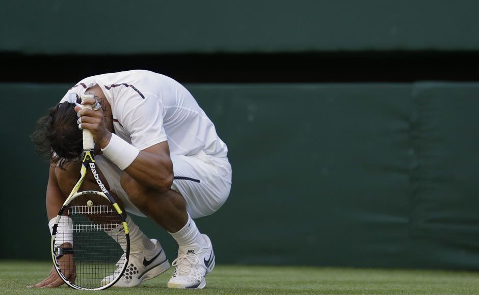 Nadal reacts after losing a point. AP Nadal reacts after losing a point. AP