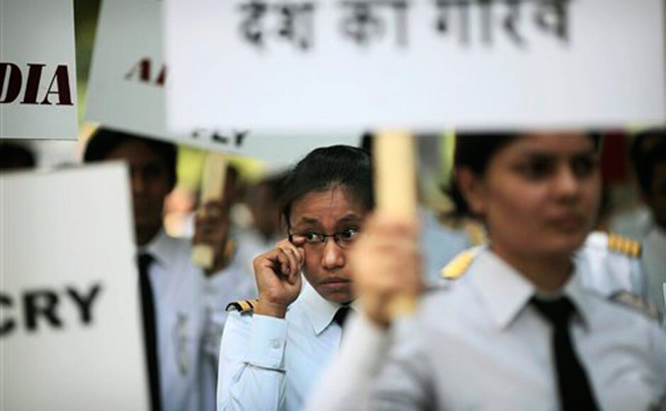 On the 30th day of the Air India strike, pilots participate in a silent protest march against Air India's management. AP On the 30th day of the Air India strike, pilots participate in a silent protest march against Air India's management. AP