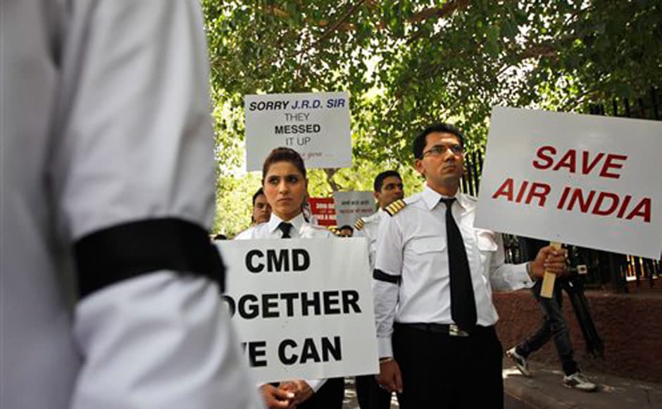 On the 30th day of the Air India strike, pilots participate in a silent protest march against Air India's management. AP On the 30th day of the Air India strike, pilots participate in a silent protest march against Air India's management. AP