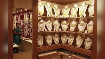 Gold prices hit record high, seen dampening demand