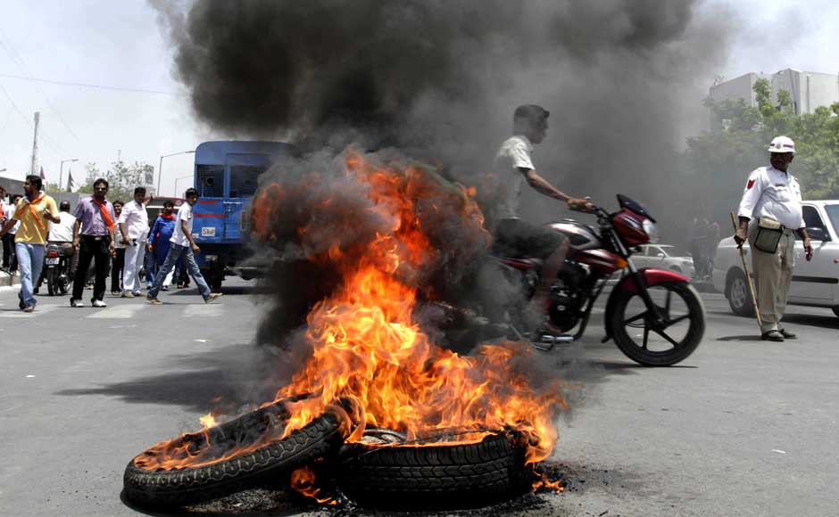 We not only deflating the tyres, we're burning them as well. Good way to ensure that buses don't run: Burning tires set ablaze by India's opposition Bharatiya Janata Party (BJP) activists as they attempt to block traffic during a nationwide strike to protest a steep hike in gas prices in Ahmedabad. Ajit Solanki/AP We not only deflating the tyres, we're burning them as well. Good way to ensure that buses don't run: Burning tires set ablaze by India's opposition Bharatiya Janata Party (BJP) activists as they attempt to block traffic during a nationwide strike to protest a steep hike in gas prices in Ahmedabad. Ajit Solanki/AP