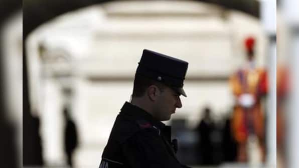 Pope's tiny police force hunts the enemy within