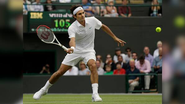 Federer through, bad boy Nalbandian loses in Wimbledon