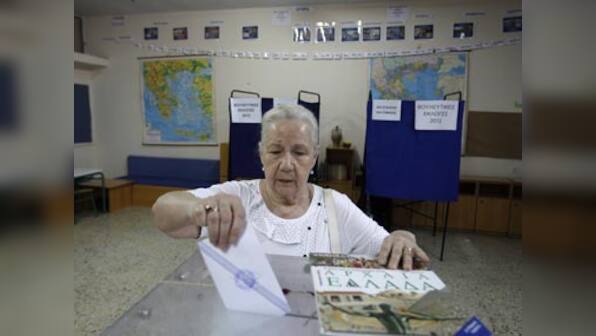 Euro's D-day arrives as Greeks begin voting 