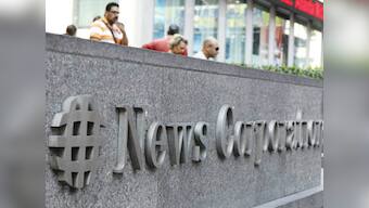 NewsCorp board approves of splitting Murdoch's empire